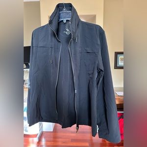 Lightweight black zip up. Nylon spandex, collar converts to a hood.